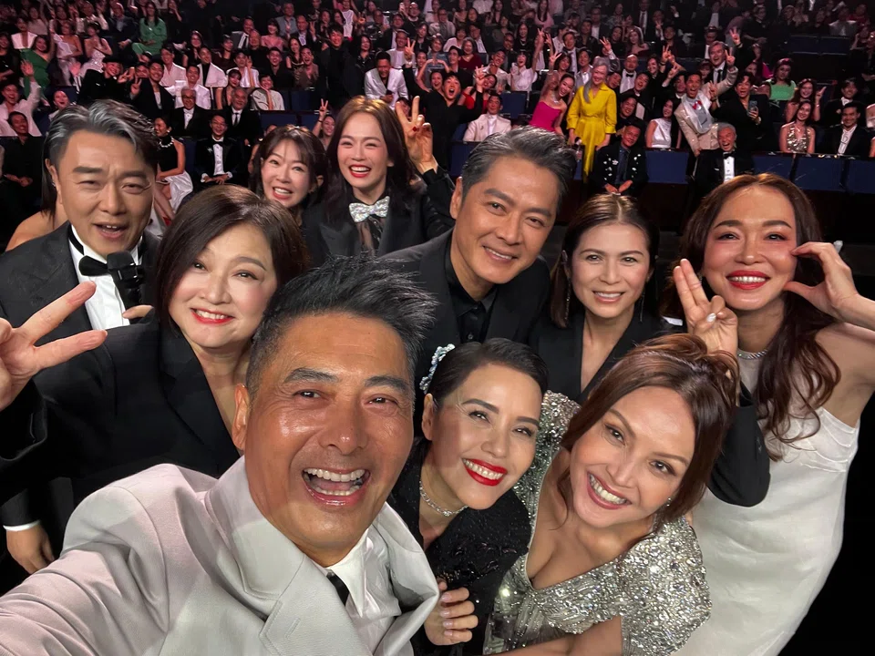 Hong Kong actor Chow Yun Fat (in white suit, in foreground) during the Star Awards on July 6, taking a wefie with stars who attended the first edition of Star Awards in 1994.