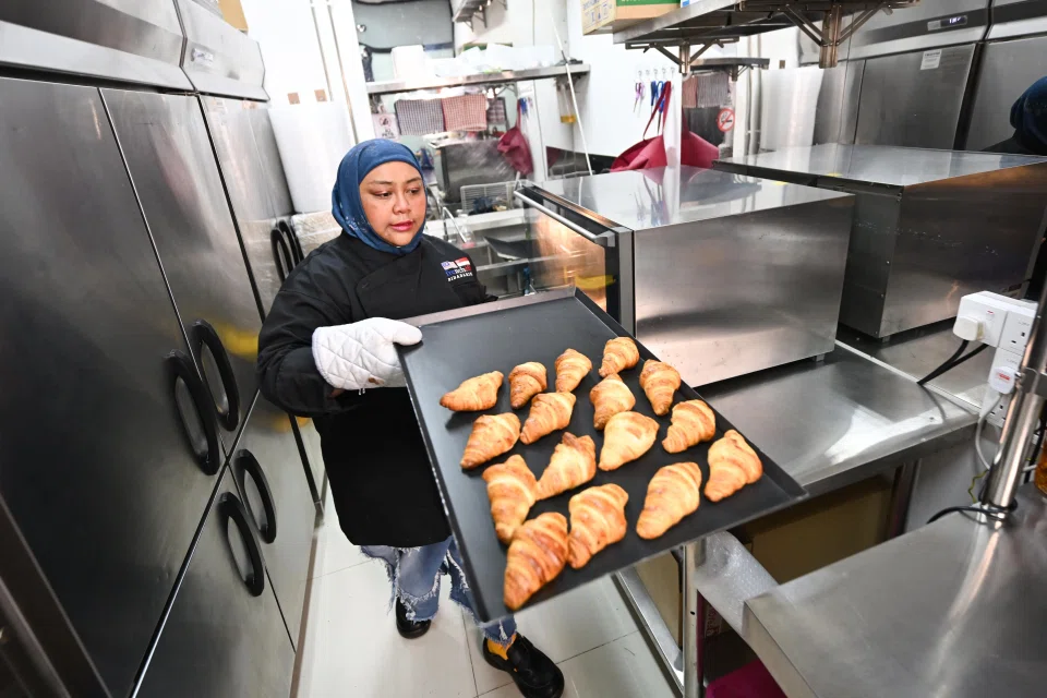 Ms Nur works from two commercial kitchen spaces. The smaller one is in Viva Vista Shopping Mall in South Buona Vista Road, while the larger one is in JB. ST PHOTO: LIM YAOHUI