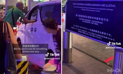Cabbies at MBS ask for $65 to go to Orchard Road, nearby sign says touting and overcharging illegal