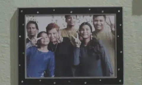 A photograph of Madam Salimah with her family.