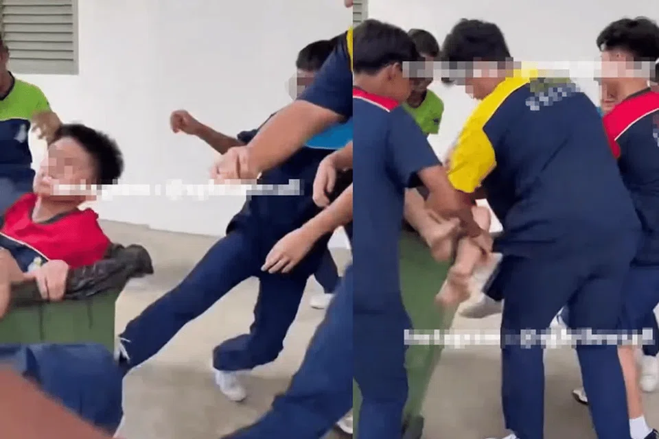 Sembawang Secondary School students messing with the rubbish bin in which their schoolmate sits.