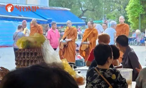 Men in monk's robes spotted collecting alms in Bedok, but money strictly not accepted