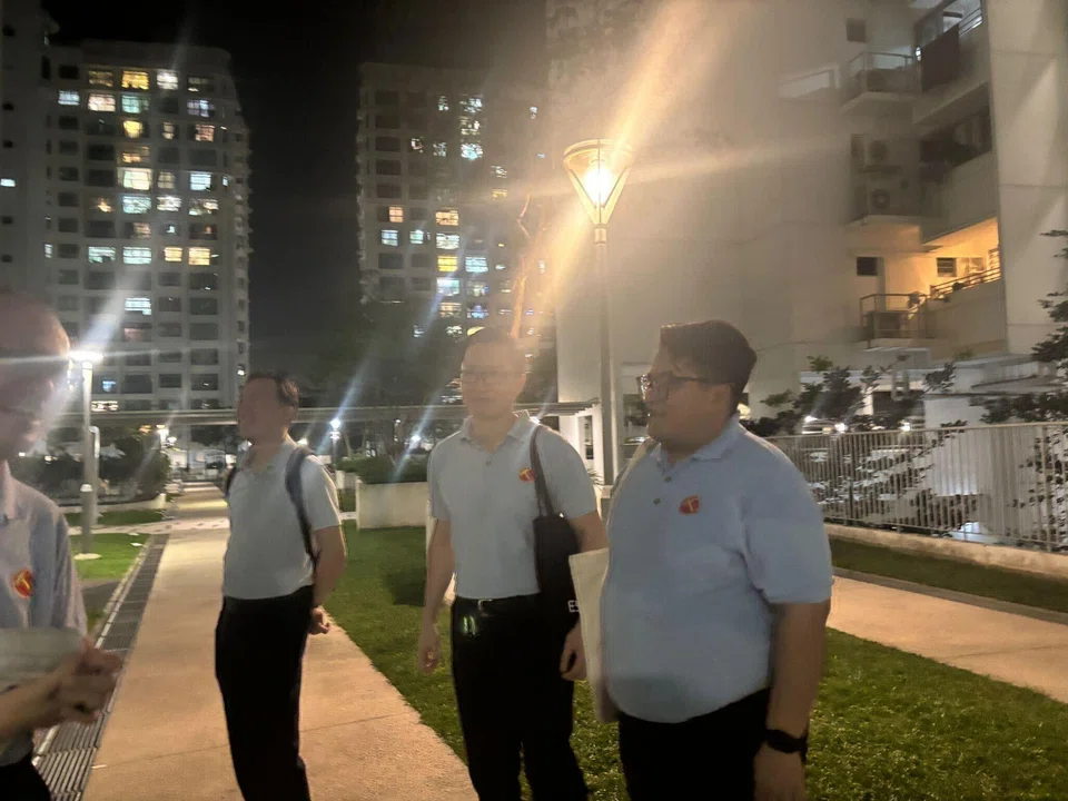 Three-time Workers’ Party candidate Yee Jenn Jong (left) seen walking the ground with self-employed corporate trainer Daniel Lee (third from left) and lawyer Sufyan Mikhail Putra (right).