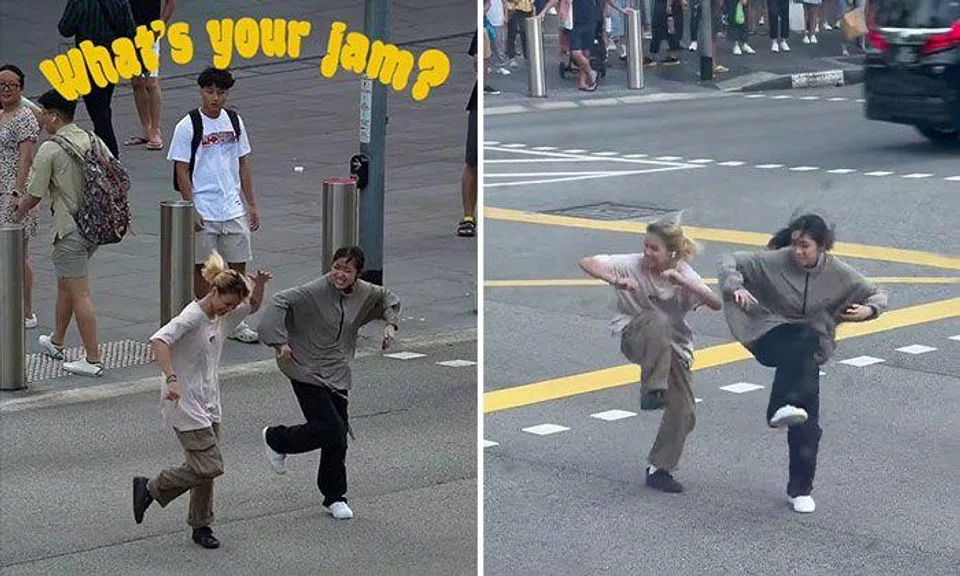 Duo bring life to Orchard Road with their smooth dance moves while crossing busy junction