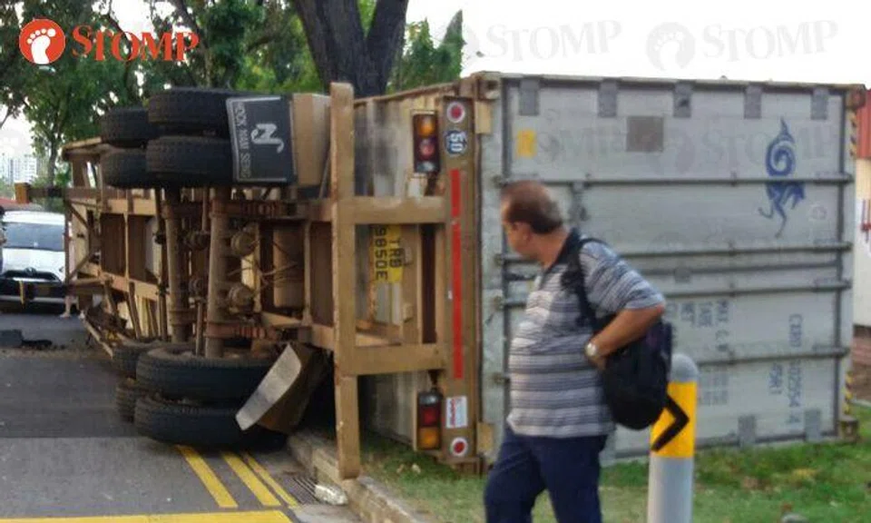 Container truck overturns on its side along Quality Road | STOMP