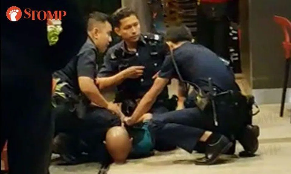 Man gets pinned down by police officers outside Rivervale Plaza McDonald's after shouting at and challenging diners