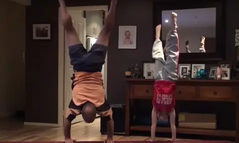 Dad boosts daughter's self esteem by trying her gymnastic moves