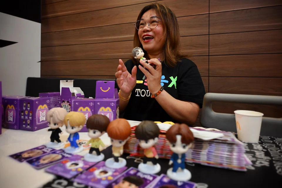 BTS fan Tess Poh bought 14 Happy Meals at a go, and managed to complete her full set.