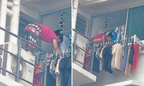 Maid climbs out of kitchen window to hang laundry on precarious 18th-floor ledge