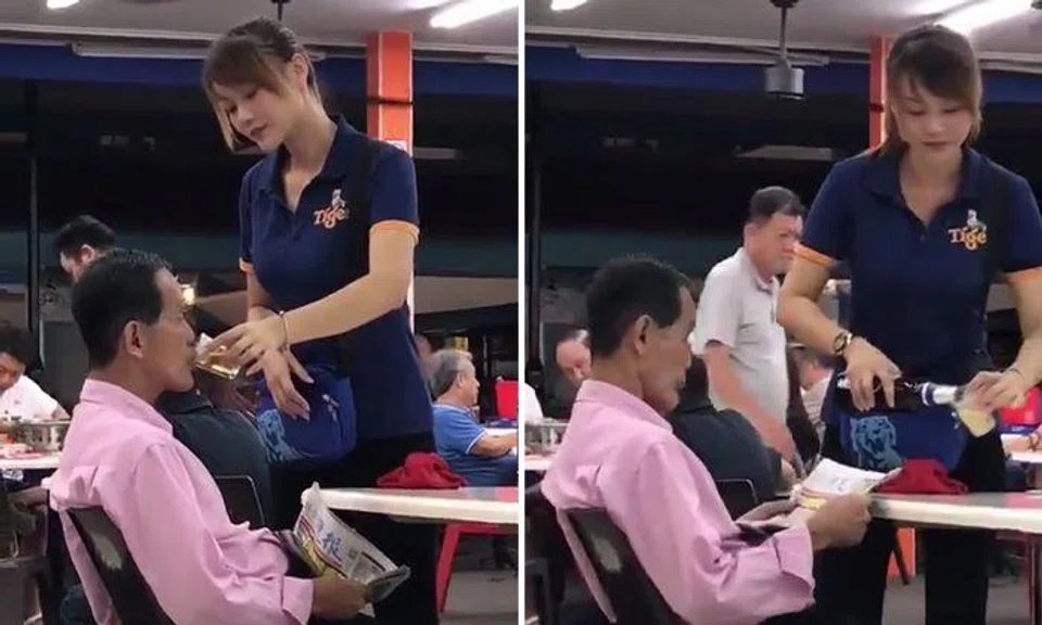 'Belle' who fed uncle beer at Bedok coffee shop given warning, will be transferred