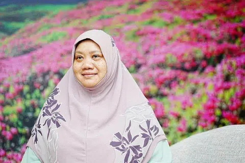 Despite battling cancer and going through a divorce, Ms Alawiyah Jaffar remained steadfast in raising her three children