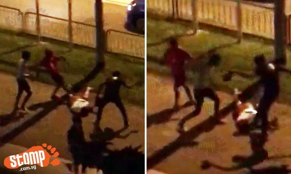 Group of men whack and rain kicks on guy at AMK -- even when he is motionless on the ground