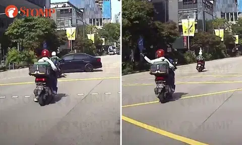 Car runs red light at Orchard Road junction, narrowly missing motorcyclist