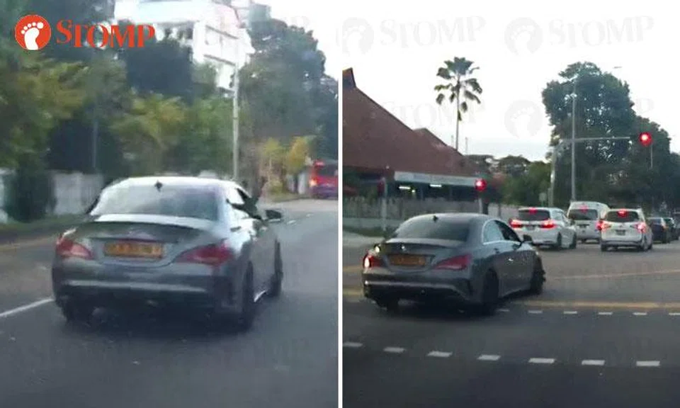 Merc driver blocks traffic, points middle finger at Stomper before running red light at Still Road