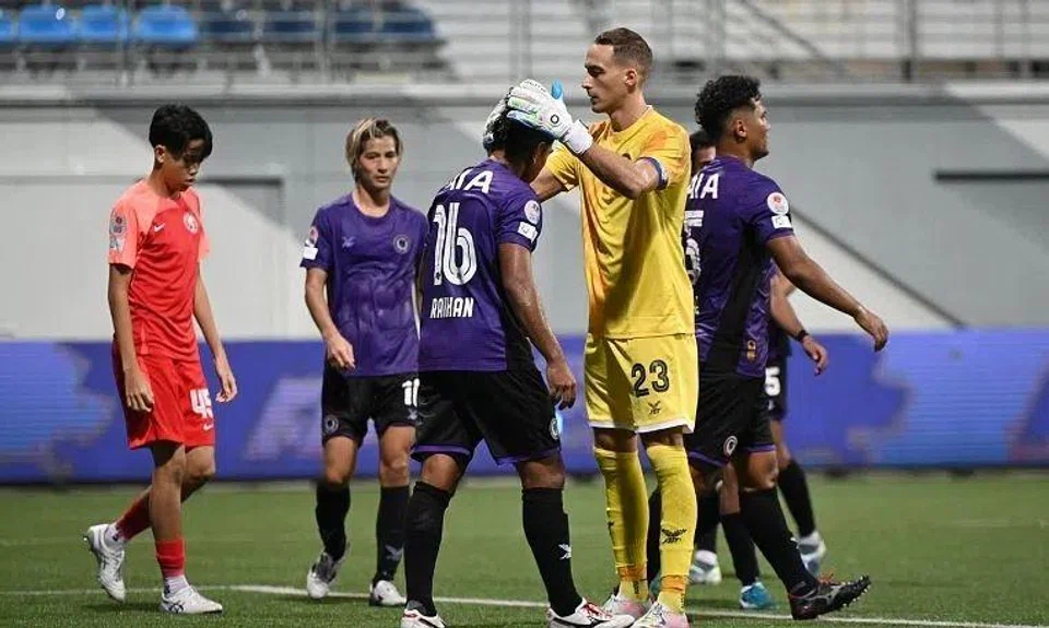 Tanjong Pagar United goalkeeper Matt Silva patting Raihan Rahman on the head after the 1-1 draw with the Young Lions.