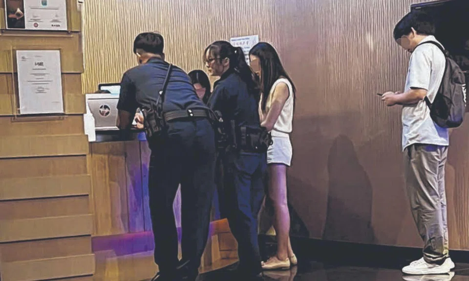 guest calls police after seeing woman using phone in geylang spa