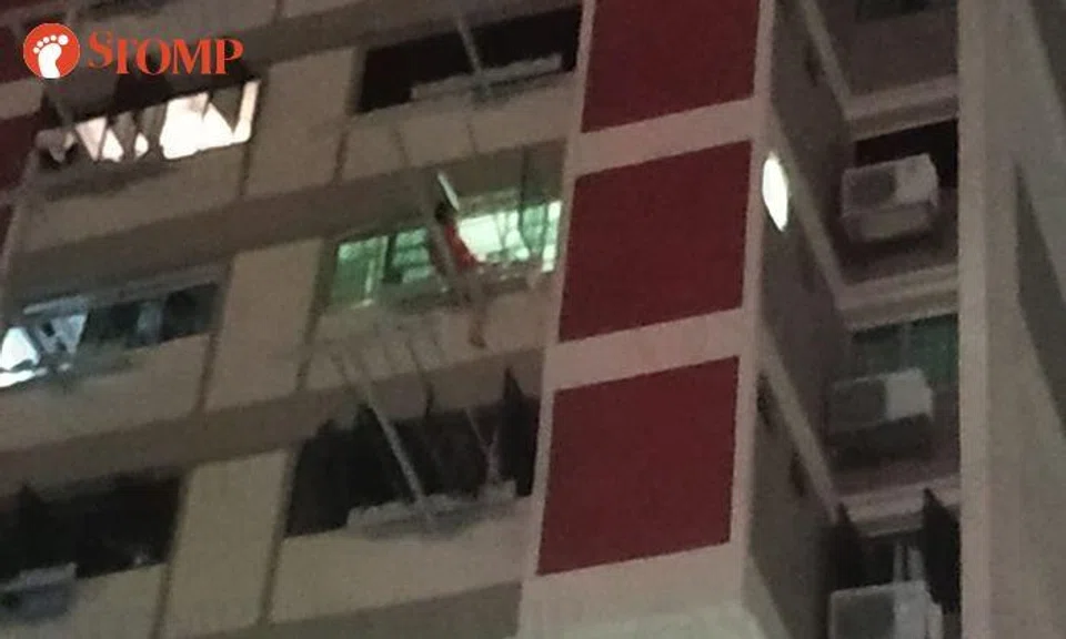 50-year-old woman arrested after seen sitting on window ledge at Waterloo HDB block