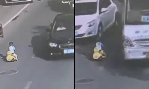 Toddler rides toy car towards oncoming traffic -- and miraculously survives