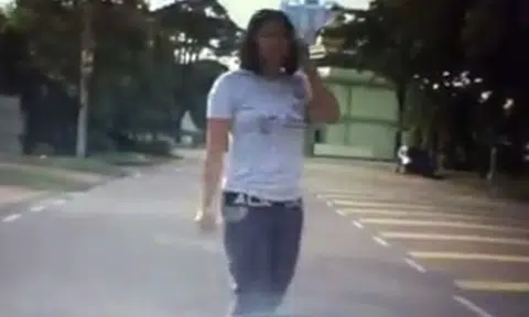 Epic fail: Malaysian girl dashes in front of car in alleged accident scam, driver steers clear