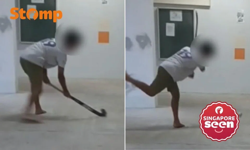 playing hockey at yishun void deck