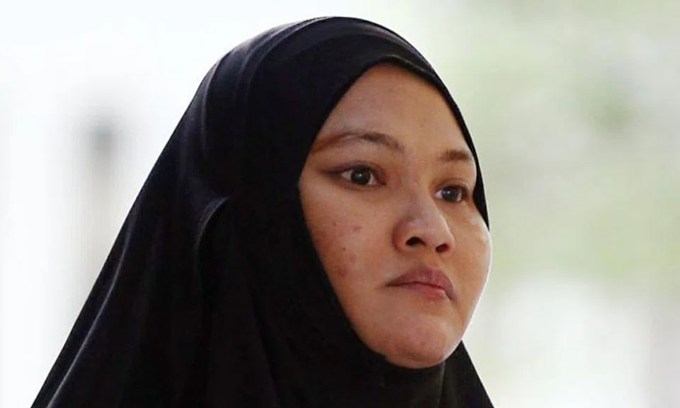 Sa'adiah Jamari is accused of two counts of administering a range medication or "poisons" to two babies with the intention of hurting them. PHOTO: ST FILE