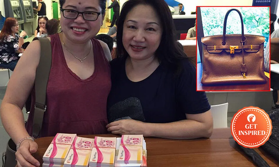 Fion (left) posing with a kind woman who donated $11k worth of vouchers but refused to take the bag. Photo: Fion's Facebook