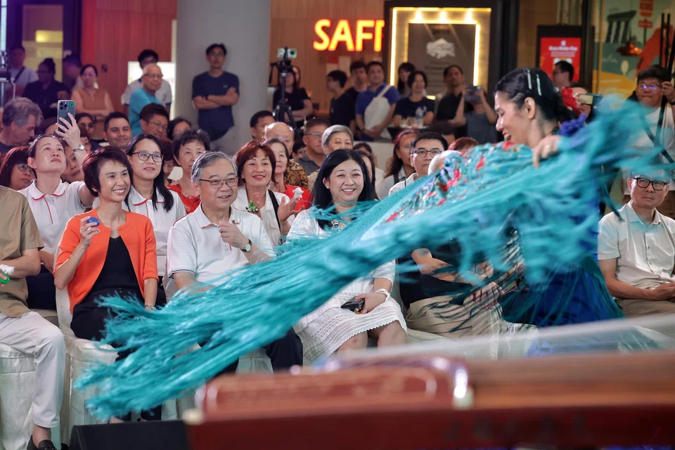 DPM Gan Kim Yong, flanked by South West District Mayor Low Yen Ling (in orange) and North East CDC vice-chairman Yeo Wan Ling, watching a flamenco performance at Safra Choa Chu Kang on March 30. Seated behind them are (from left) PAP new faces Chua Wei-Shan and Choo Pei Ling.