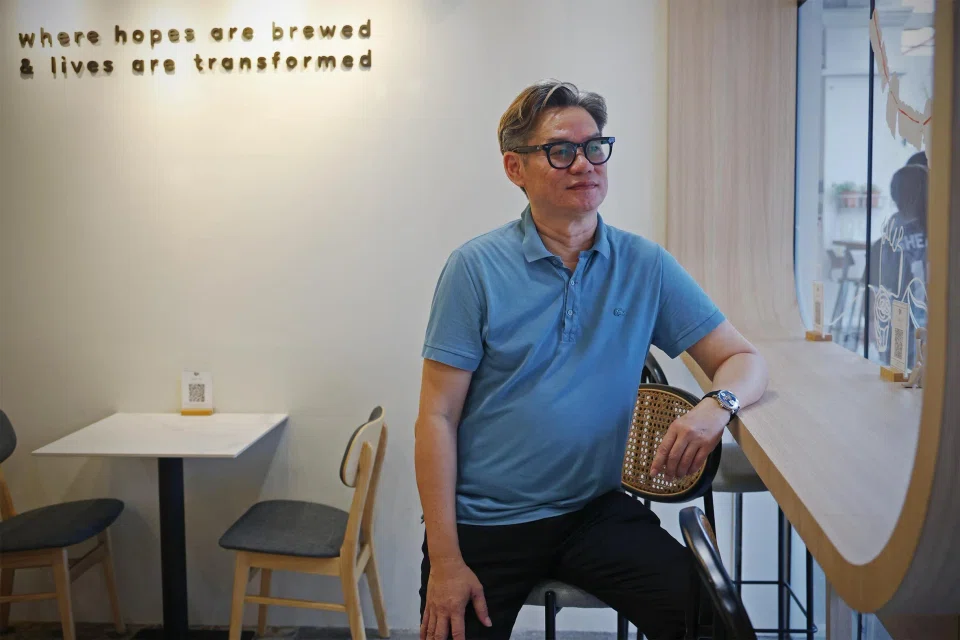 Mr Theophilus Tan at Just BrewIN cafe. The former taxi driver's daughter, Vinnie, was only 13 when police officers handcuffed him and led him away in August 2012. ST PHOTO: JASON QUAH