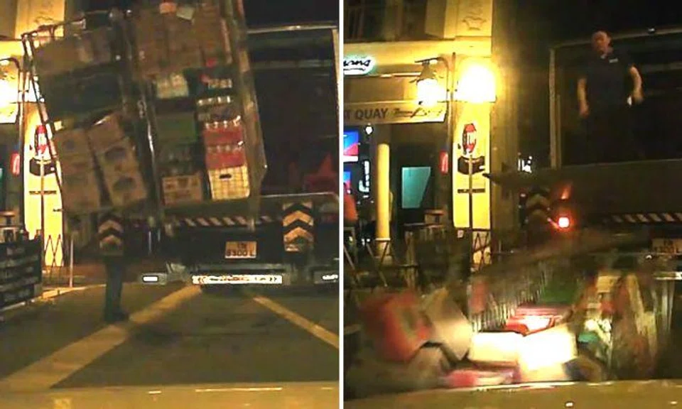 Driver's 'spider-senses' save him from being hit by cartons of beer at Boat Quay