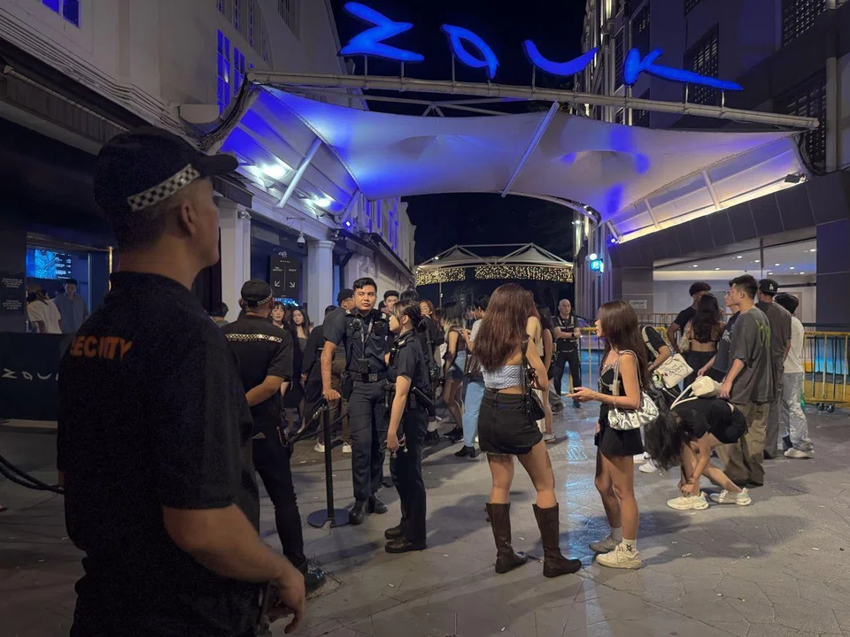Police and security patrolling outside Zouk in Clarke Quay on July 19.
