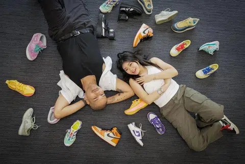 (From left): Profile of Joshua Simon and Shawnia Seah, both deejays from Kiss92, with part of their sneaker collections photographed at News Centre on Nov 29, 2024. They also hold iPads to show them designing their own sneakers as part of the...