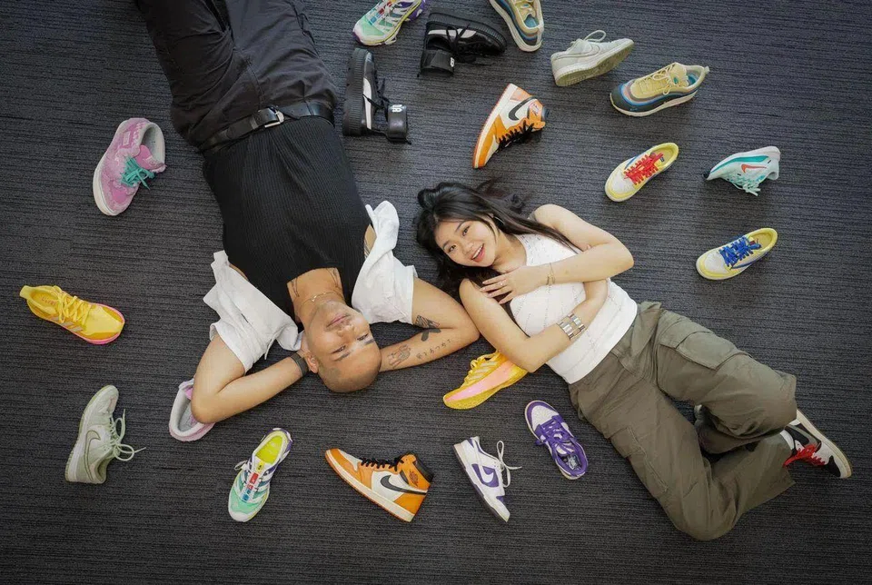 (From left): Profile of Joshua Simon and Shawnia Seah, both deejays from Kiss92, with part of their sneaker collections photographed at News Centre on Nov 29, 2024. They also hold iPads to show them designing their own sneakers as part of the...