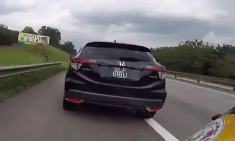 Speed demon 'chiongs' down Malaysian highway and emergency lane like it's his grandfather's road