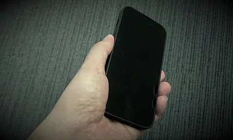 As the boy played a game on the phone, the man raped him.