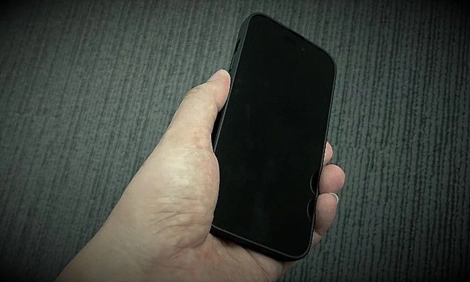 As the boy played a game on the phone, the man raped him.