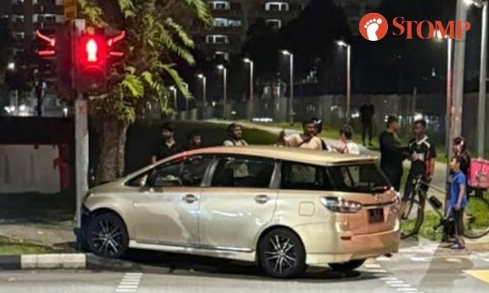 Toyota jumps kerb at pedestrian crossing in Yishun