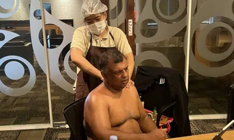 Tony Fernandes says half-naked pic of him getting massage during work call was to show 'multitasking'