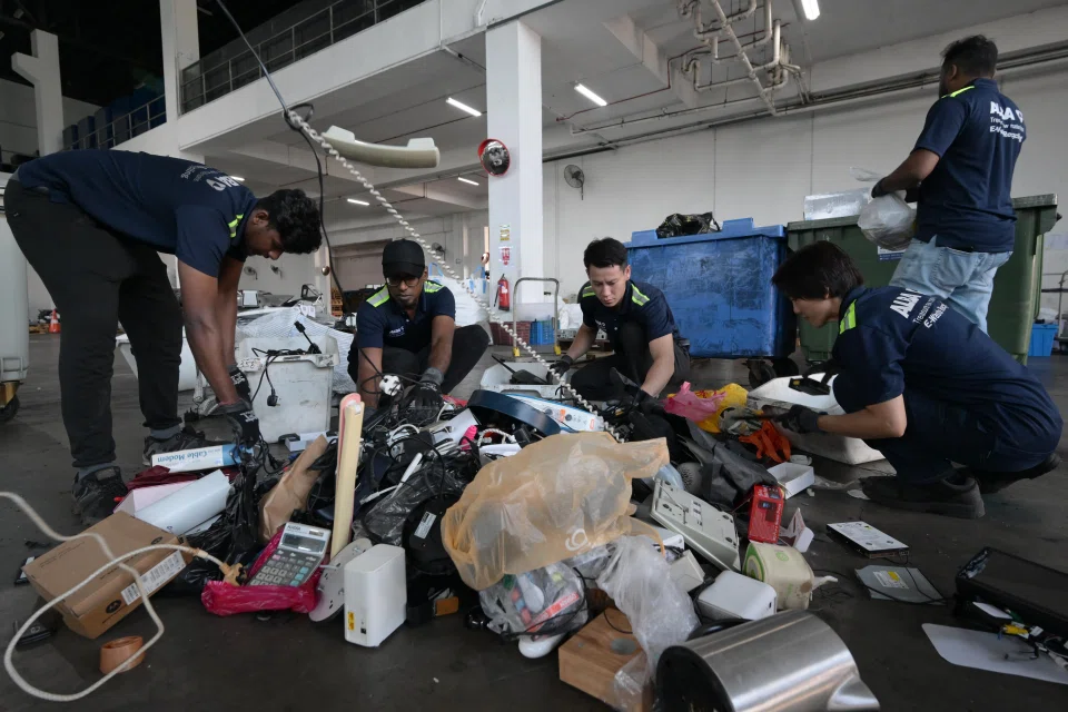 Collected e-waste are sorted at Alba E-Waste Smart Recycling's warehouse in Tuas.