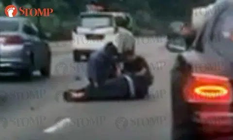 Accident victim lies motionless on SLE: Passing Police officers and motorists stop to help