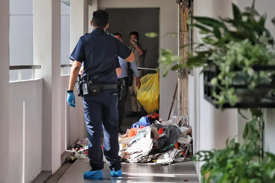 Some items, believed to have been cleared from the unit, were scattered outside the flat. 