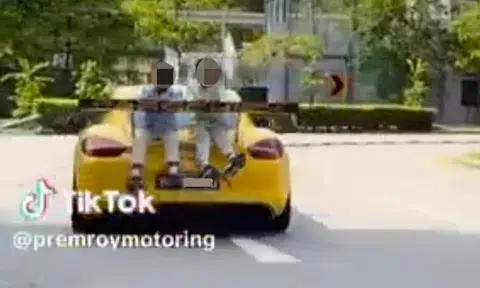 Man to be charged with rash act after allegedly driving with 2 children seated atop car boot