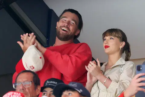 Football star Travis Kelce says he and pop superstar Taylor Swift are "just two people who are in love". 