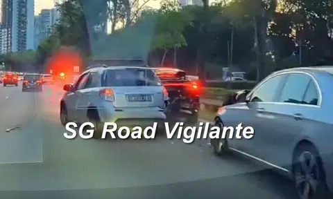 a light grey suzuki car crashes into a black car on the central expressway