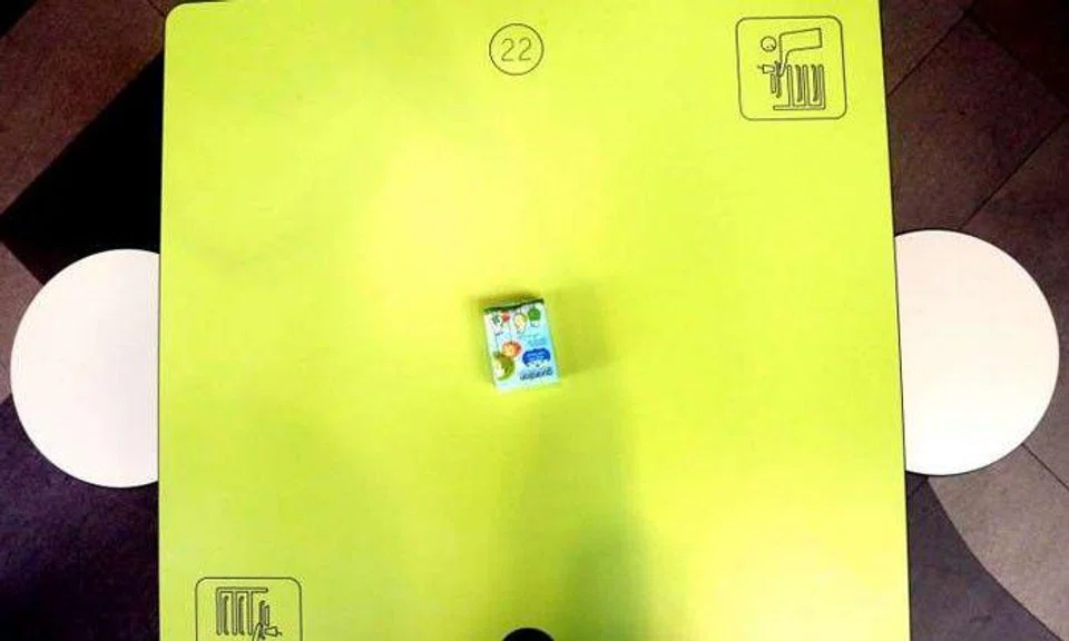 Diners chope the table with a packet of tissue paper at the food centre at Our Tampines Hub.PHOTO: ST FILE