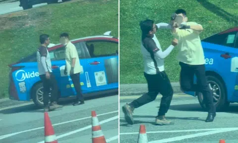 Lorry and taxi driver fighting on the street