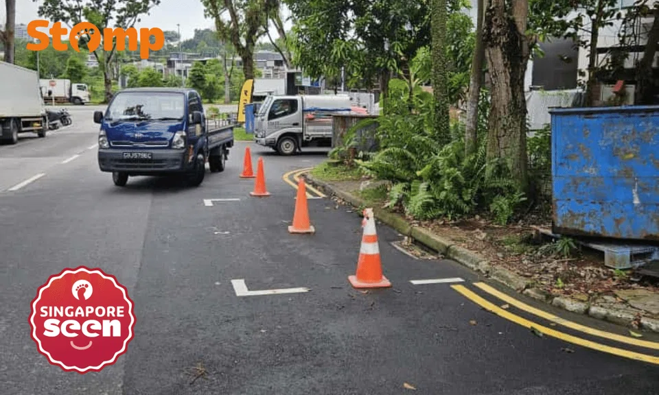 Safety cones used to reserve parking space on a public road.