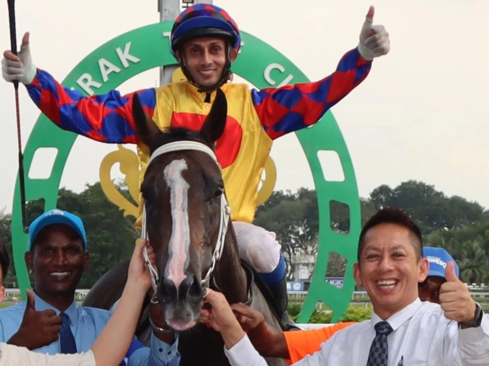 Thumbs up all round as trainer David Kok (right) celebrates at the Ipoh winner's circle after Wonderful Boss (Harmeet Singh Gill) fought back to beat JB Kaingeh (Tham Kim Chong) in the Class 5A (1,400m) on Feb 8. 
