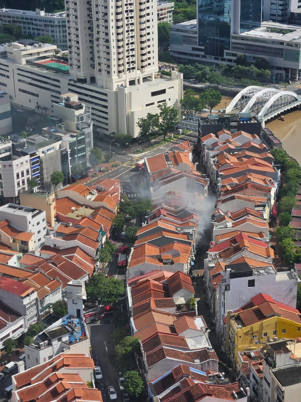 Smoke was seen billowing out of a shophouse at 16 Circular Road.