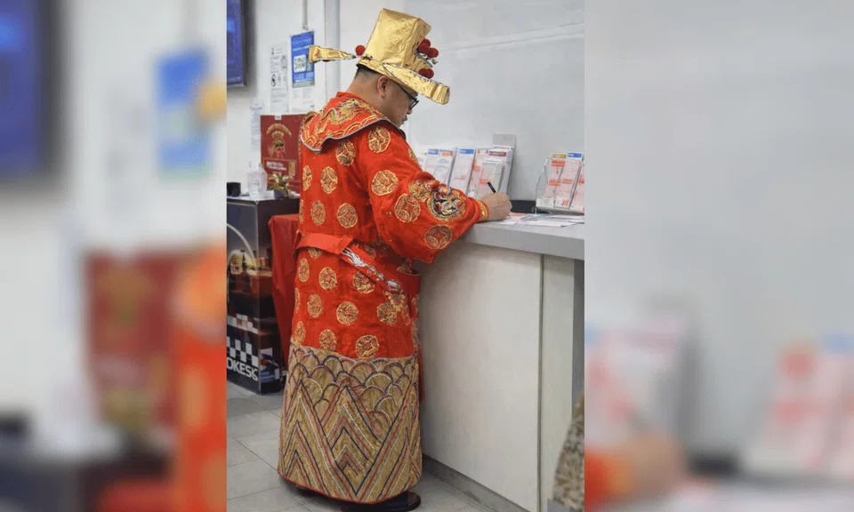 The God of Fortune was spotted apparently buying Toto a day before the $12 million Hong Bao draw, leaving amused netizens lamenting in jest that times are bad.