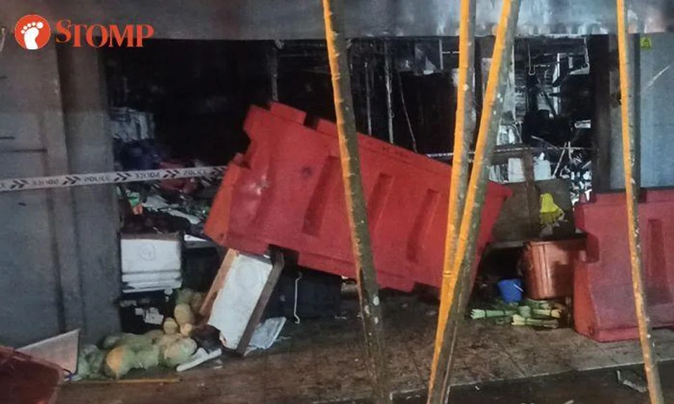SCDF conducts forced entry to put out fire at wet market in Sembawang Mart